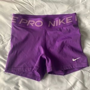 Purple Nike compression shorts